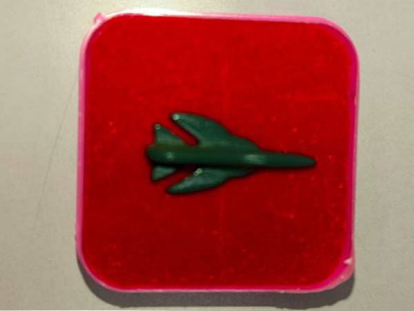 Red Square Fighter Jet Enamel Pin Military Aircraft Lapel Pin with Green Jet Design for AviationMilitary Collectors